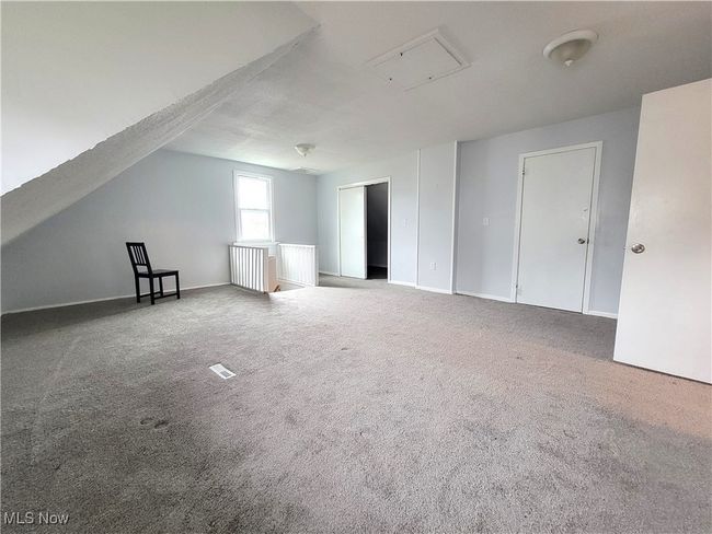 Another view of the 2nd floor bonus room with carpet flooring. | Image 8