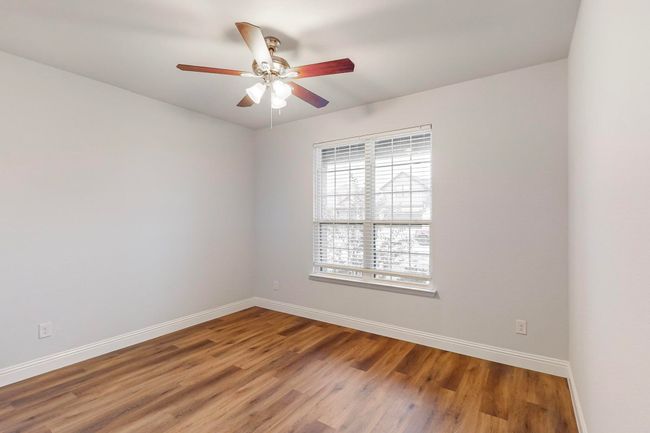 Empty room featuring hardwood / wood-style flooring and ceiling fan | Image 14