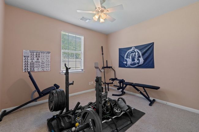 Bedroom featuring baseboards, a ceiling fan. | Image 27