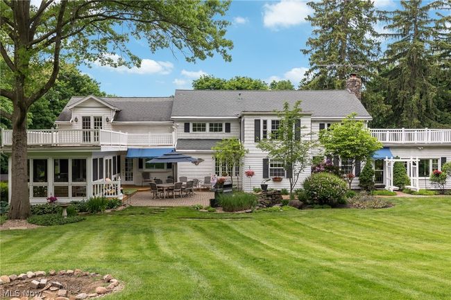 Back of house with a patio area, a balcony, and a yard | Image 9