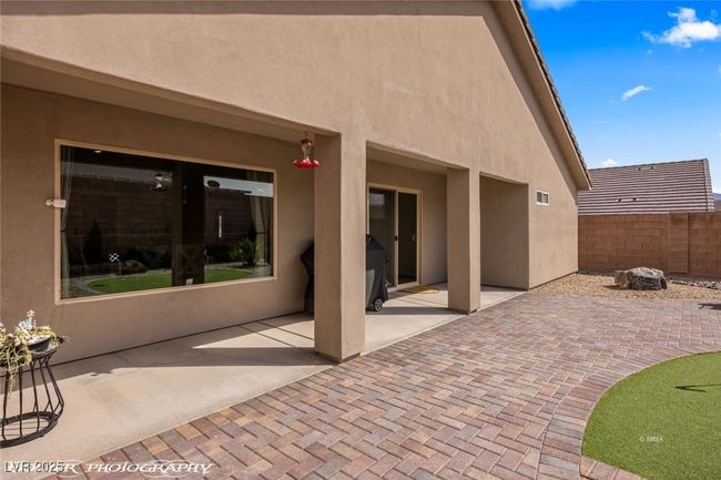 Back of house with stucco siding, a patio area, and fence | Image 49