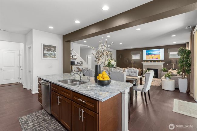 At the heart of the home, this kitchen effortlessly blends modern elegance with comfortable living! | Image 11