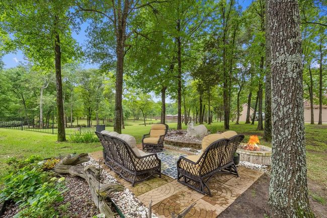 View of terrace with an outdoor living space with a fire pit | Image 11