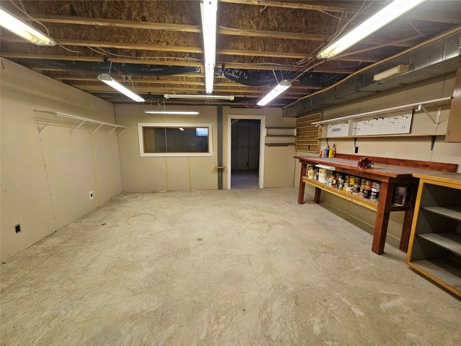 How about a work room with an attached extra room for more storage | Image 29