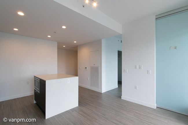 Unfurnished room with light wood-style floors, recessed lighting, and baseboards | Image 10
