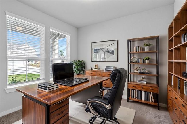 Nestled away quietly in the front of the home is the handsome and grand home office. Featuring neutral paint, beautiful plush carpet and large windows with privacy blinds! | Image 4