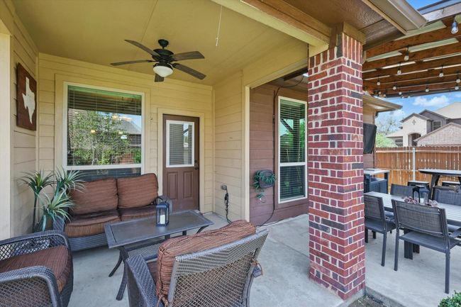 View of patio / terrace featuring outdoor dining area, outdoor lounge area, fence, and a ceiling fan | Image 31