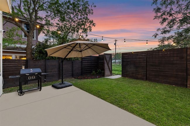 Wrap around back yard is perfect for relaxing on the large patio, tiered yard with sidewalk, privacy fencing and three gates. | Image 26