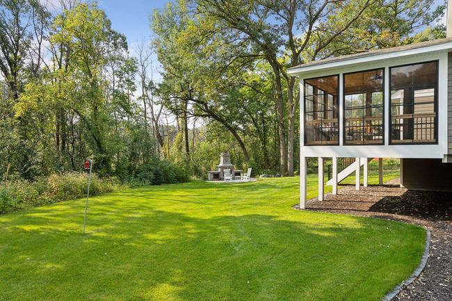Private backyard with flat green space | Image 54