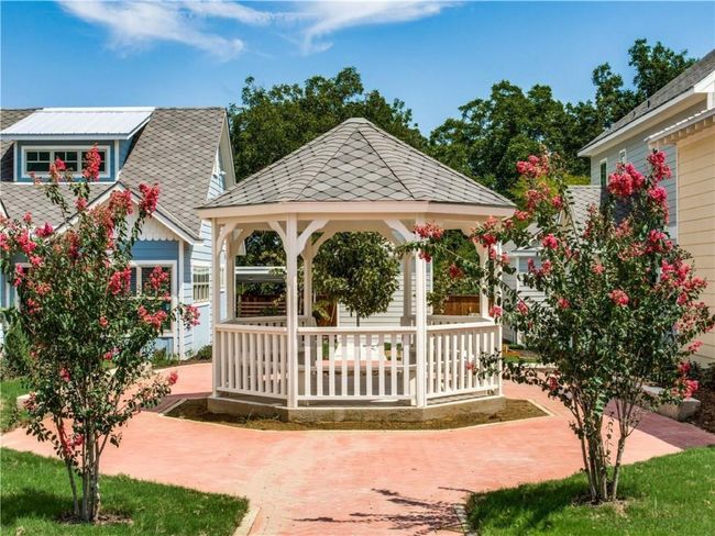 The centerpiece gazebo adds to the charm of the community. 407 Cedar Apt 1 is to the left. | Image 14