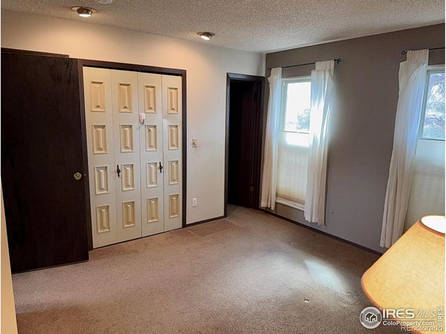 PRIMARY BEDROOM WITH TWO CLOSETS, 3/4 BATH ALONG WITH TWO LARGE WINDOWS WITH SHADES | Image 13
