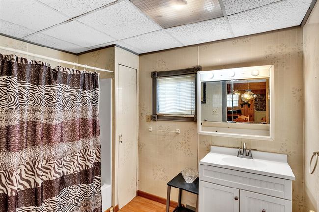 Located on the first floor, this full bath is equipped with both a tub and shower. | Image 15