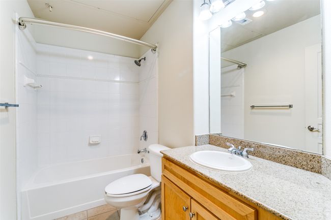 Hall bathroom with ample storage and combo bath/shower. | Image 11