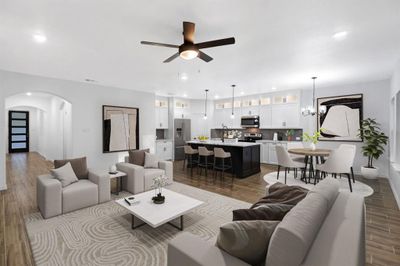 Living room featuring dark wood-type flooring, ceiling fan, and sink | Image 2