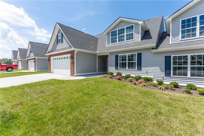 View of front facade featuring a garage and a front lawn | Image 2