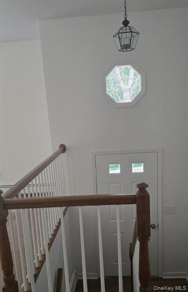 Staircase featuring wood finished floors | Image 10