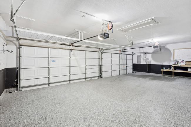Garage with a garage door opener | Image 36