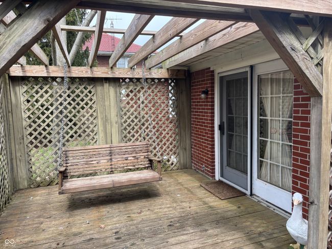 wooden terrace featuring a pergola | Image 16