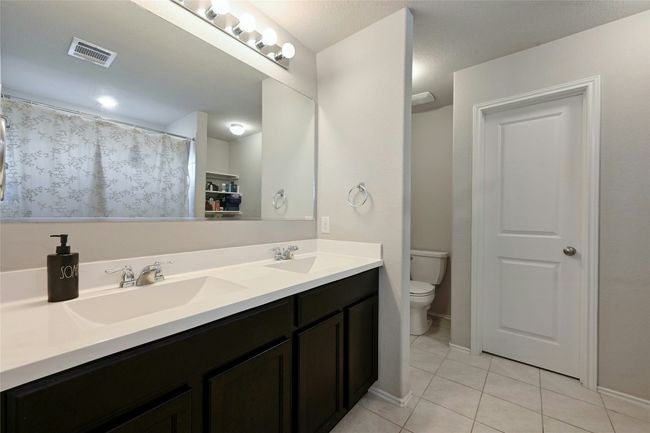 Full bathroom with tile patterned flooring and double vanity | Image 5