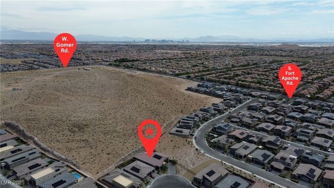 Drone / aerial view of a desert landscape and a mountain backdrop | Image 36