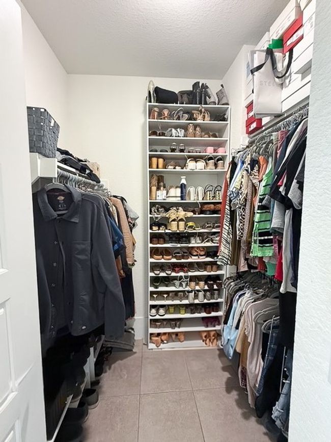 Spacious closet featuring tile patterned floors | Image 17