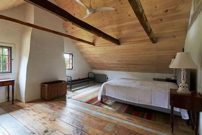Unfurnished bedroom with lofted ceiling with beams and multiple windows | Image 9