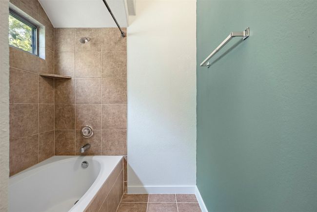 Thoughtfully designed for ease and comfort, this ensuite bath offers all the essentials in a clean, efficient layout that compliments the tranquility of the primary suite | Image 22