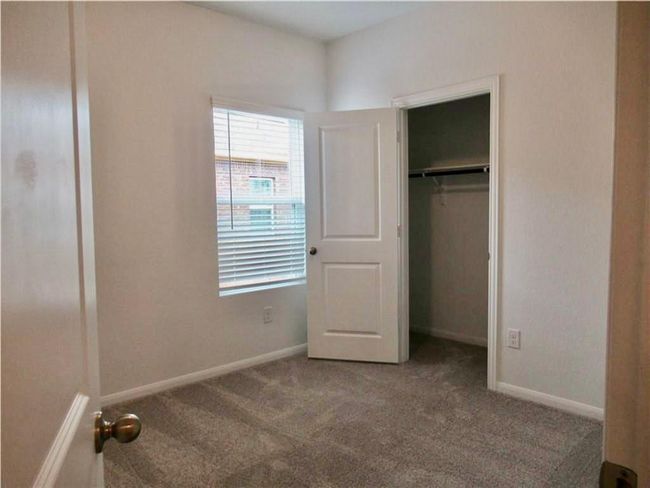 Unfurnished bedroom featuring carpet and a closet | Image 8