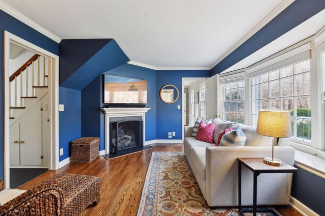 Family room with backyard views and a gas fireplace. | Image 8
