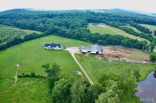 View of rural area featuring a large body of water | Image 6