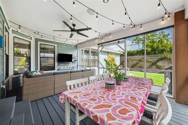 Fully screened-in back porch for eating. | Image 12