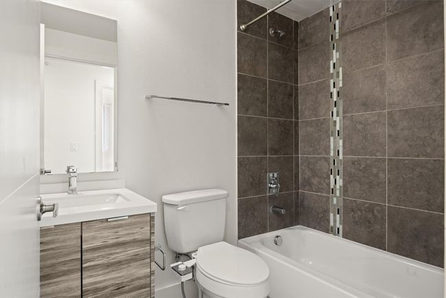 Guest bath (full) featuring vanity and bathing tub / shower combination | Image 14