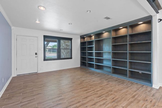 Spare room with ornamental molding, baseboards, wood finished floors, and recessed lighting | Image 5