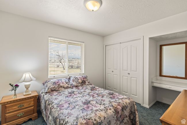 Bedroom with built-in desk/vanity | Image 26