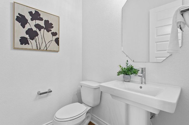 Half bath featuring toilet and baseboards | Image 21