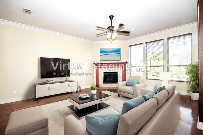 Virtual -Living area with wood finished floors, ceiling fan, ornamental molding, baseboards, and a glass covered fireplace | Image 28