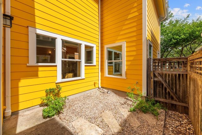 The quaint xeriscaped yard is a perfect small space for your pet to roam, offering a low-maintenance, pet-friendly area that’s both functional and easy to care for | Image 33