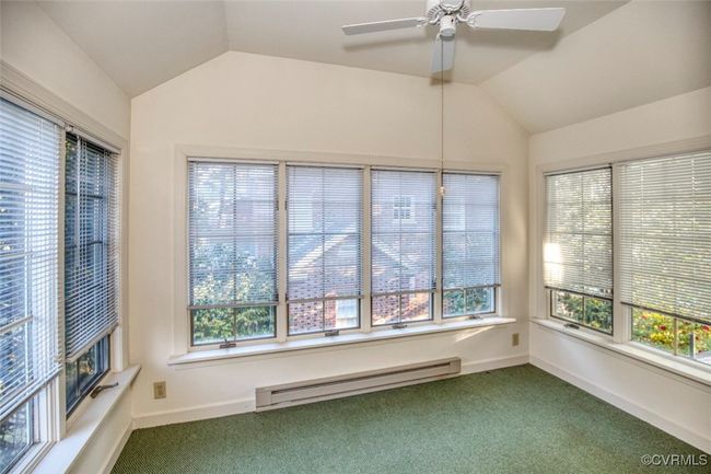Unfurnished sunroom featuring baseboard heating | Image 20