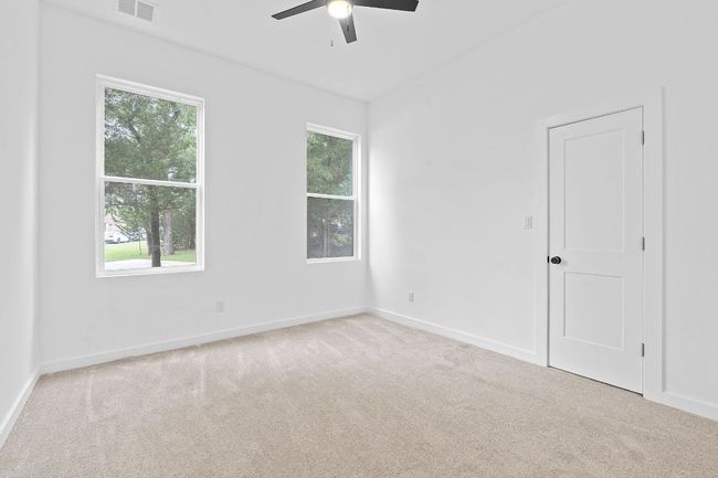 Empty room with carpet floors, ceiling fan, baseboards | Image 20