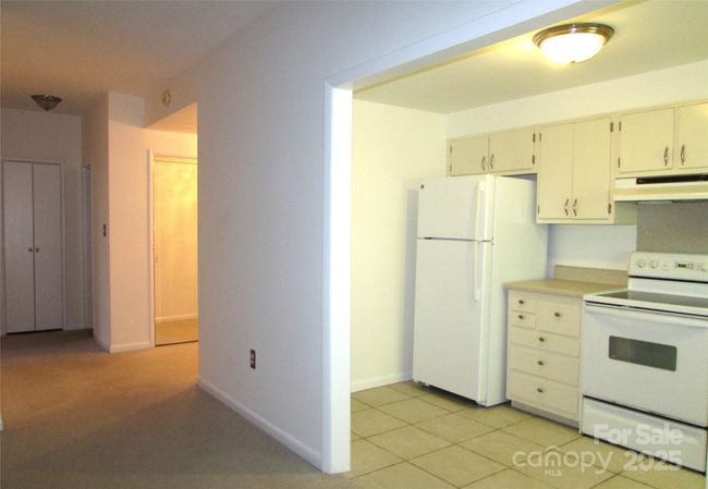 View from LR showing kitchen and entrance/hall | Image 15