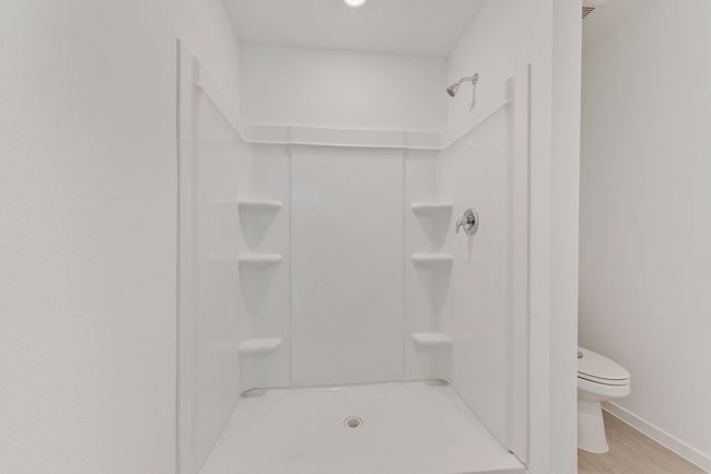 Full bathroom with a stall shower and wood finished floors | Image 22