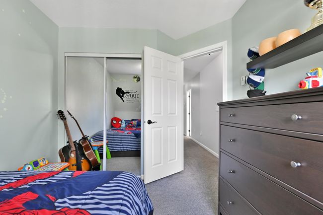 Bedroom with a closet, baseboards, and carpet floors | Image 30