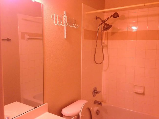 Bathroom featuring vanity and shower / washtub combination | Image 14