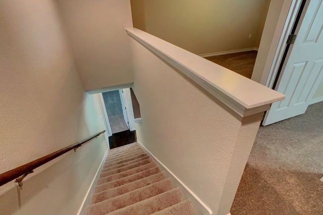 Staircase featuring carpet flooring and baseboards | Image 20