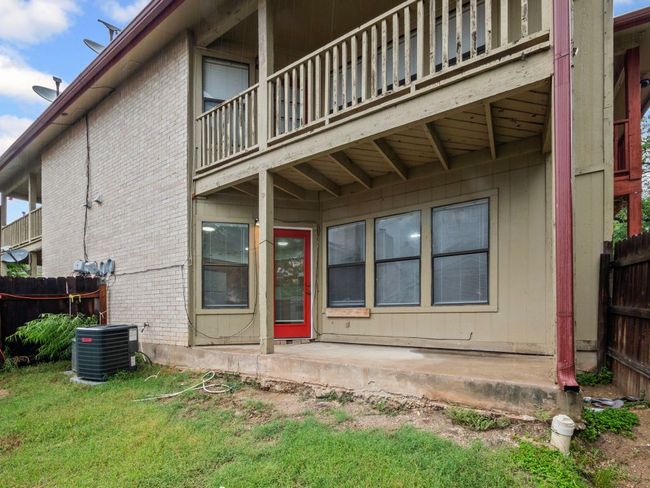 View of home's exterior with a balcony, brick siding, and a patio area | Image 17