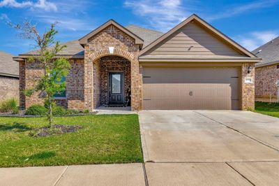 View of front property featuring a front yard and a garage | Image 2