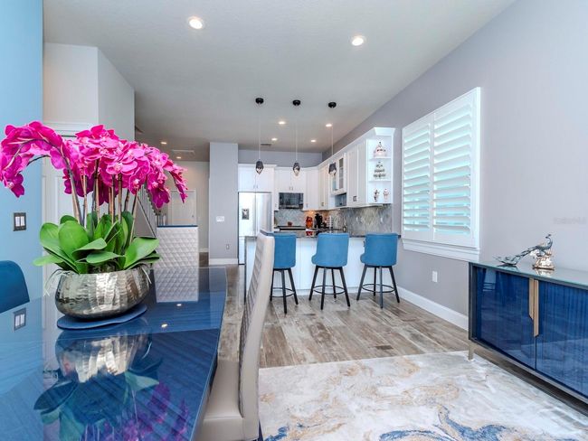 THROUGH LIVING ROOM TO STEPS TO MASTER SUITE, BATHROOM 2 AND 2ND BEDROOM | Image 49