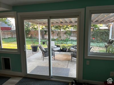 View of front of home with a front lawn and a garage | Image 1