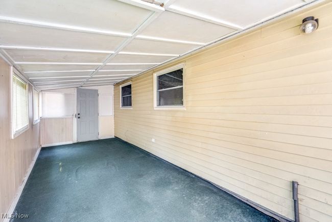 View of unfurnished sunroom | Image 34