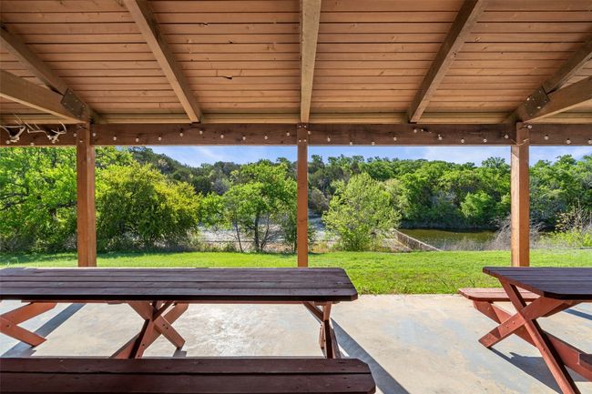 View of patio / terrace featuring a water view | Image 9